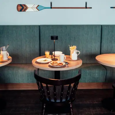 A table with plates and cups on it.