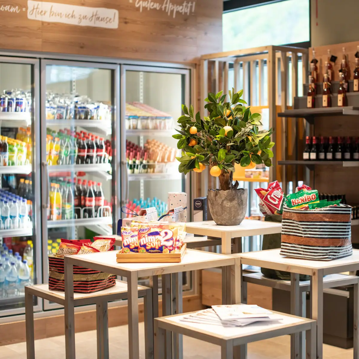 A table with food and a plant on it.