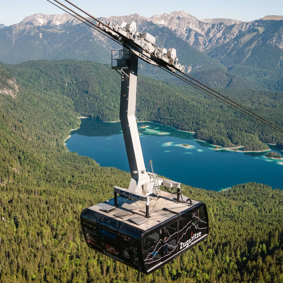 Two sights in Garmisch-Partenkirchen: The Eibsee lake behind the Zugspitze railway.