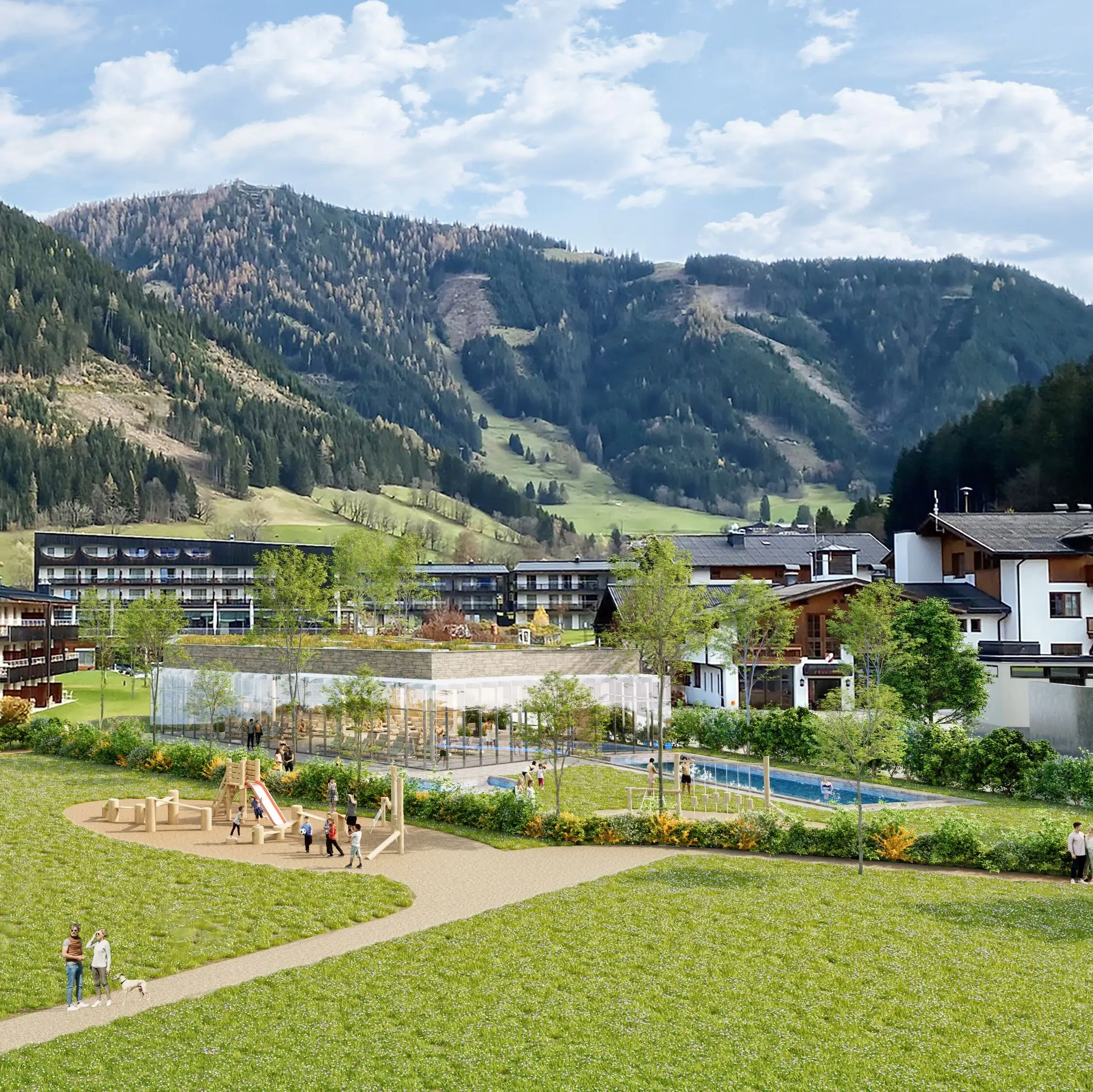 A group of people playing in a park with a playground in the background, the new bathhouse building and the hotel.