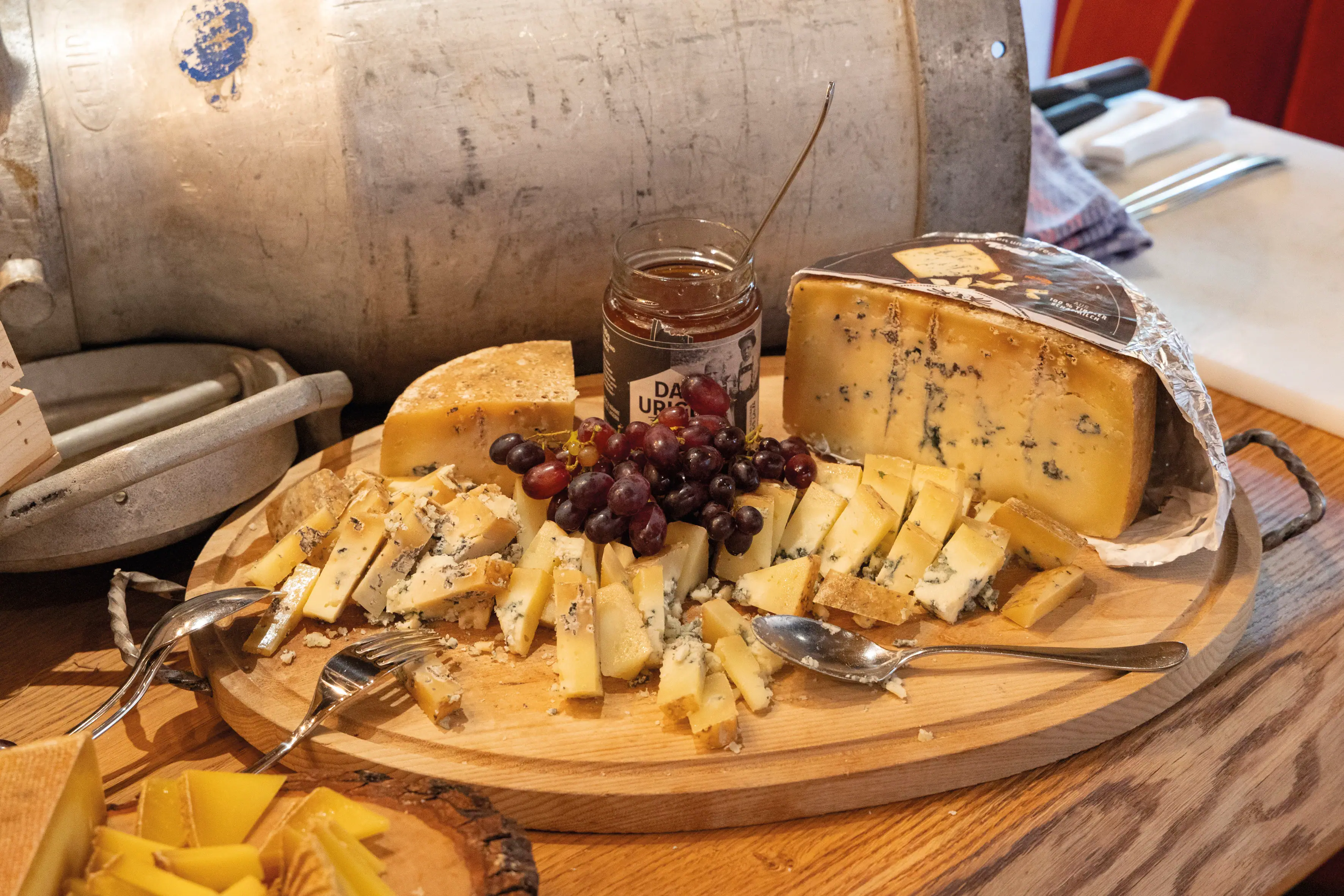 Cheese A plate of cheese and grapes.
