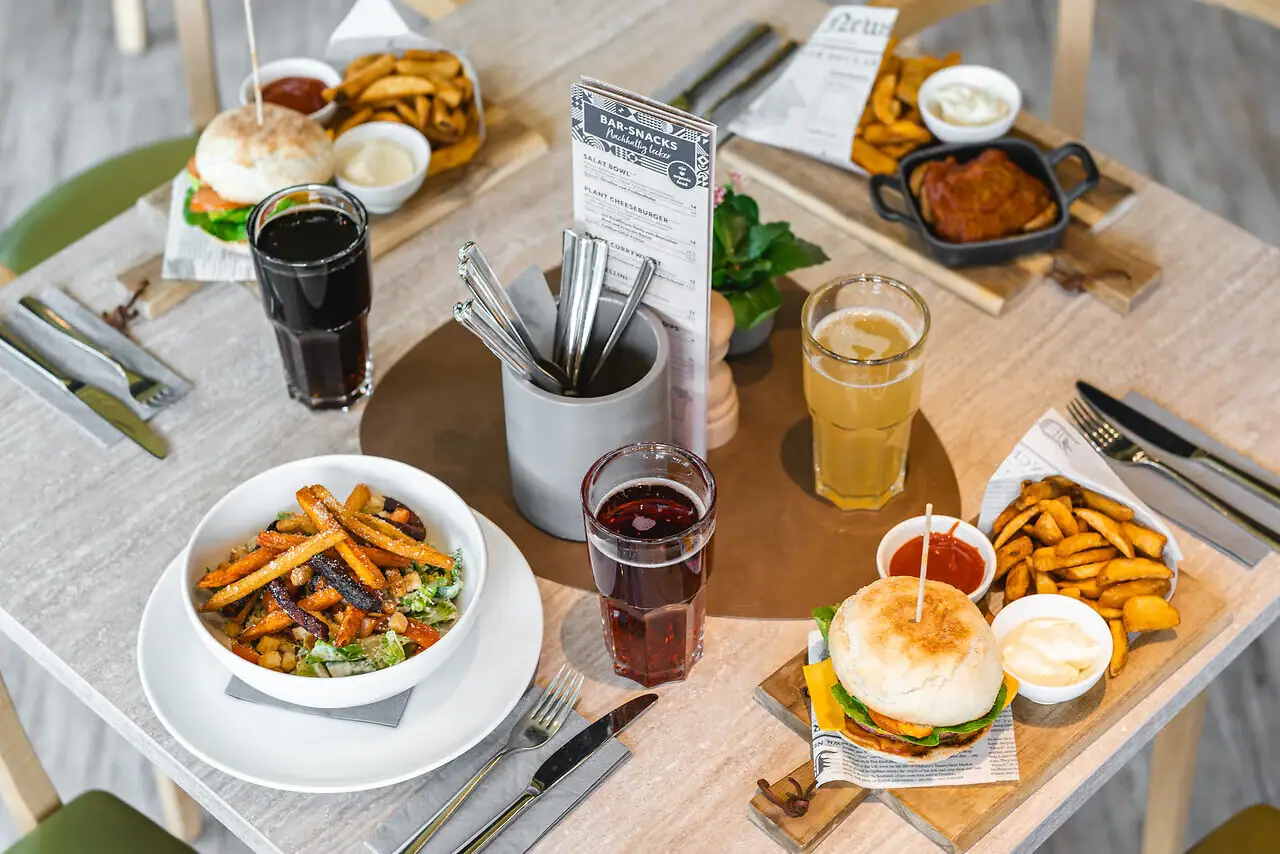 A table with various dishes on it.