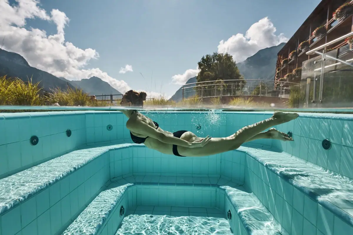 A woman swims in a pool.