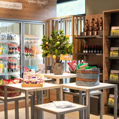 A table with food and a plant on it.