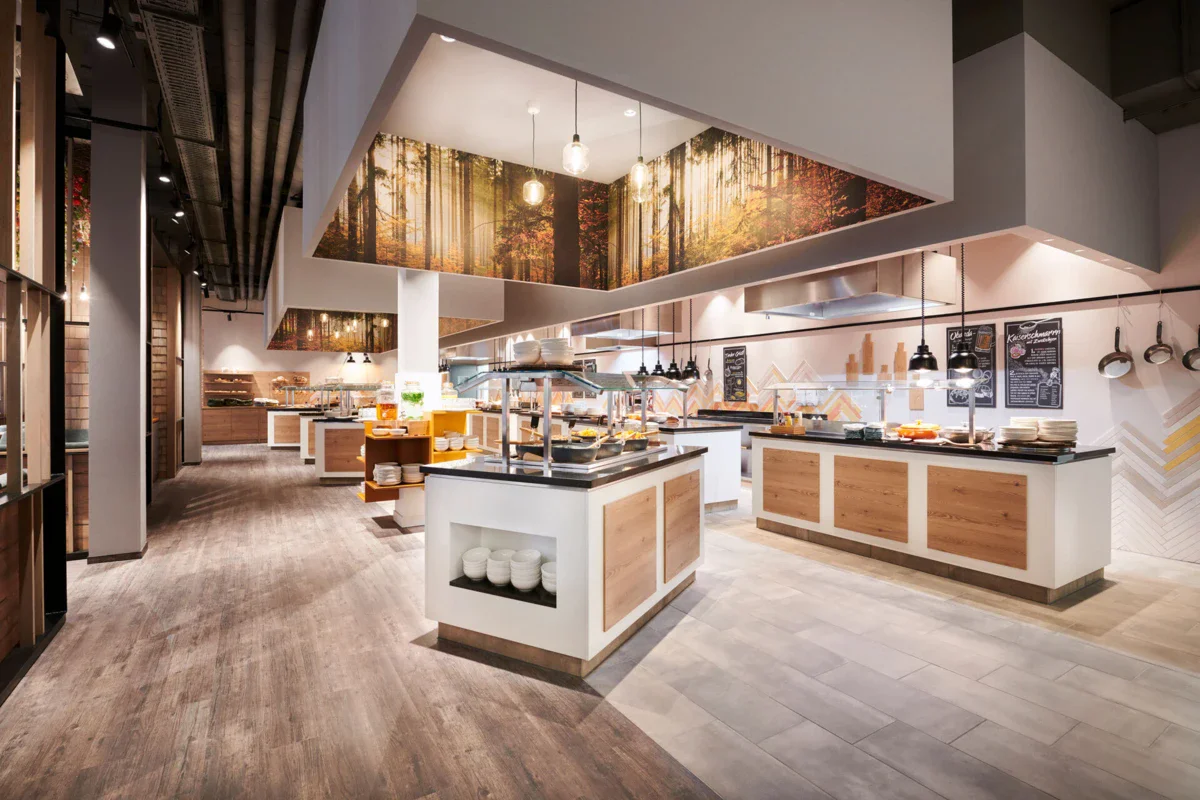 A restaurant with food on the counter.