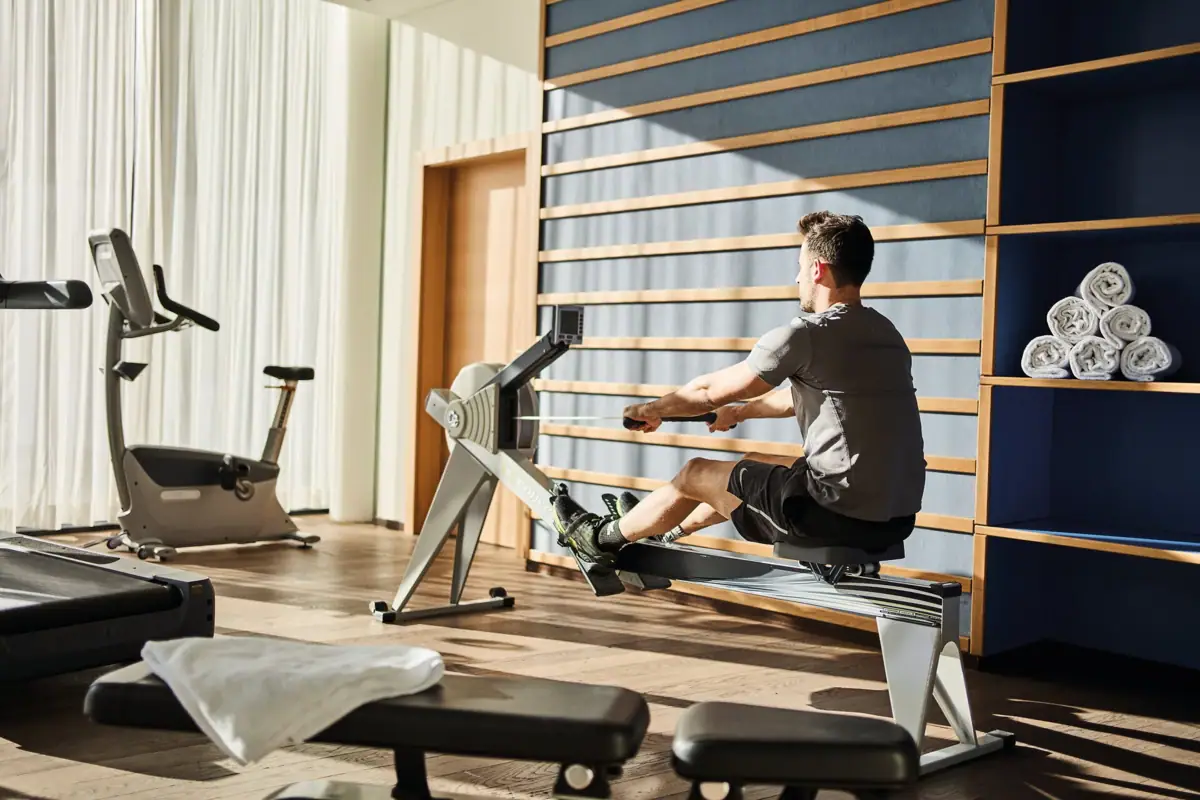 A man on a rowing machine.