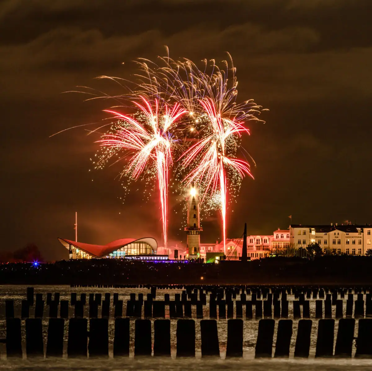 New Year's Eve at aja Warnemünde Fireworks in the night sky over the city.