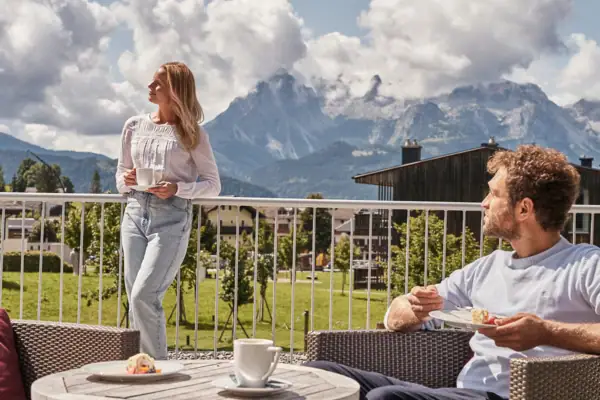 Terrace  A man and a woman on a balcony.