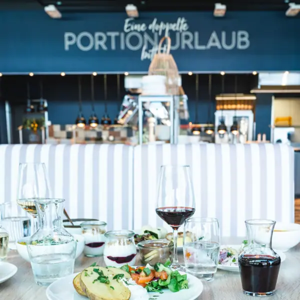 A table with food and glasses.