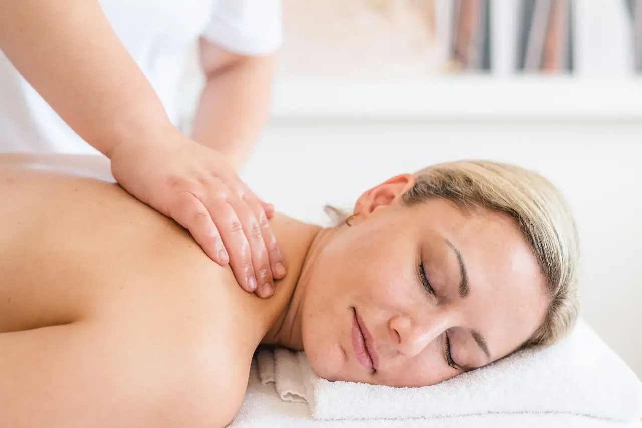 aja SPA Cards A woman lies on a white towel with her eyes closed.