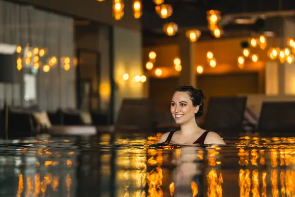 Indoor pool A woman smiling in the pool.