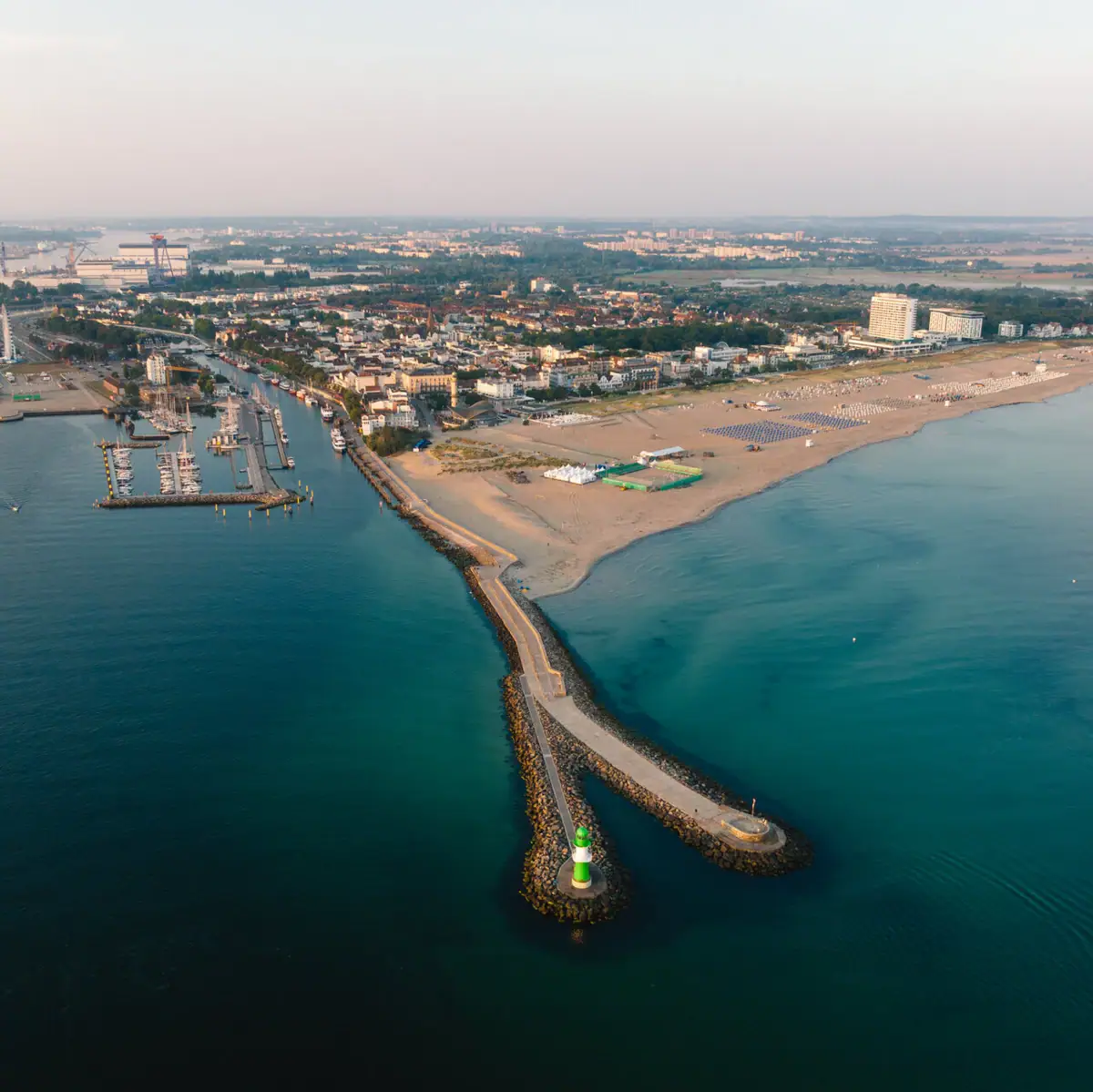 Aerial view of the beach and Warnemünde by the sea.