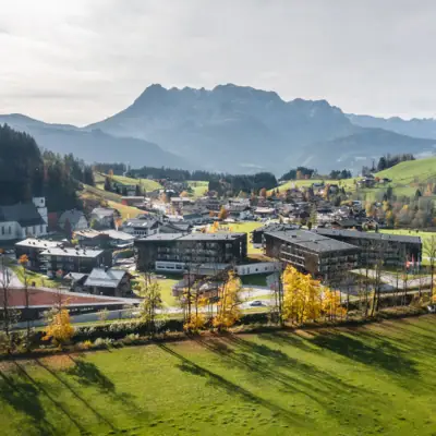 Werfenweng mountain resort A town in a valley with mountains in the background.