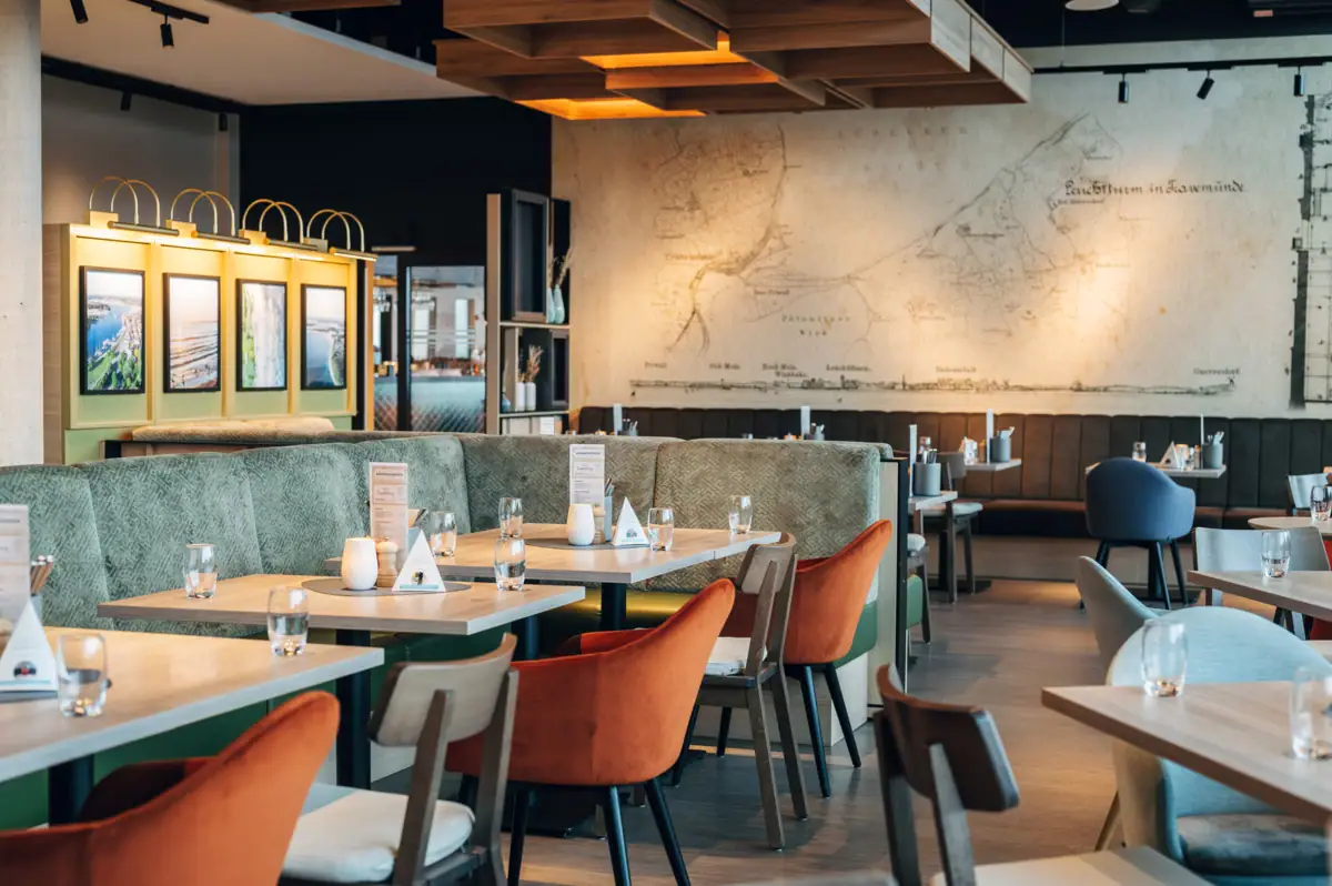 A restaurant with tables and chairs.