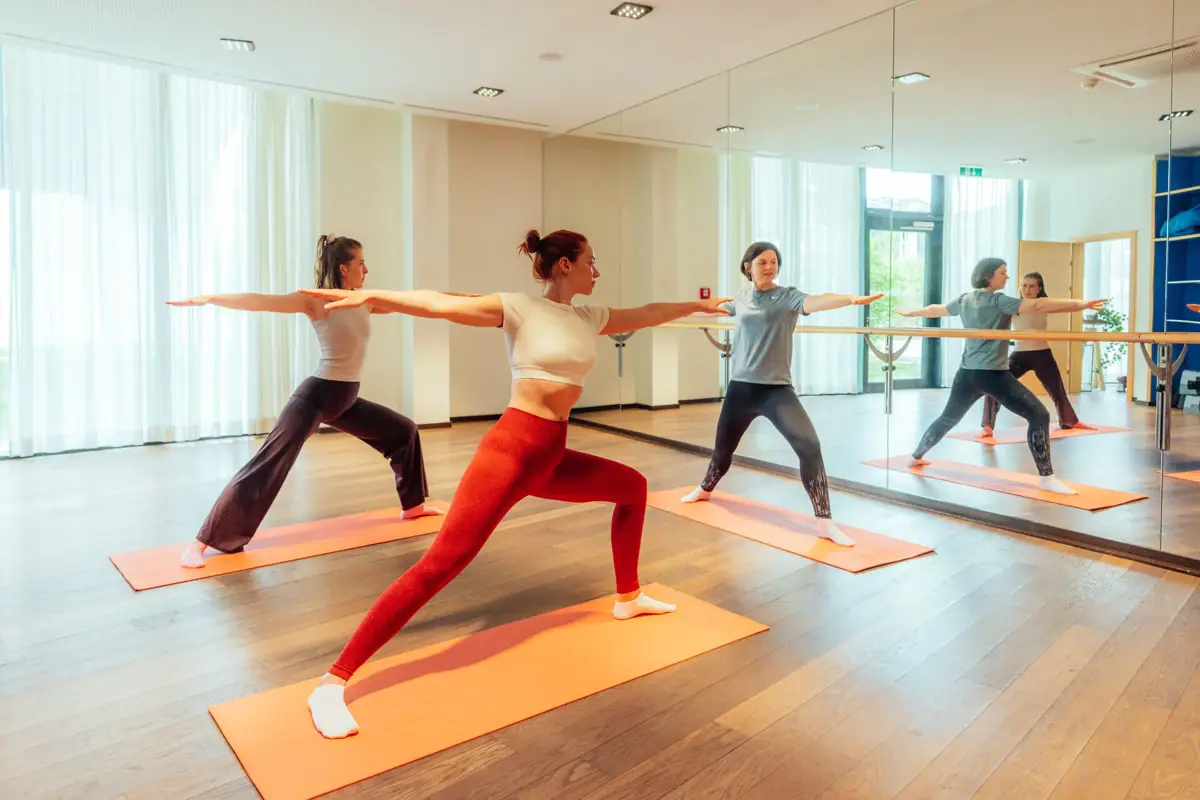 A group of women doing yoga.
