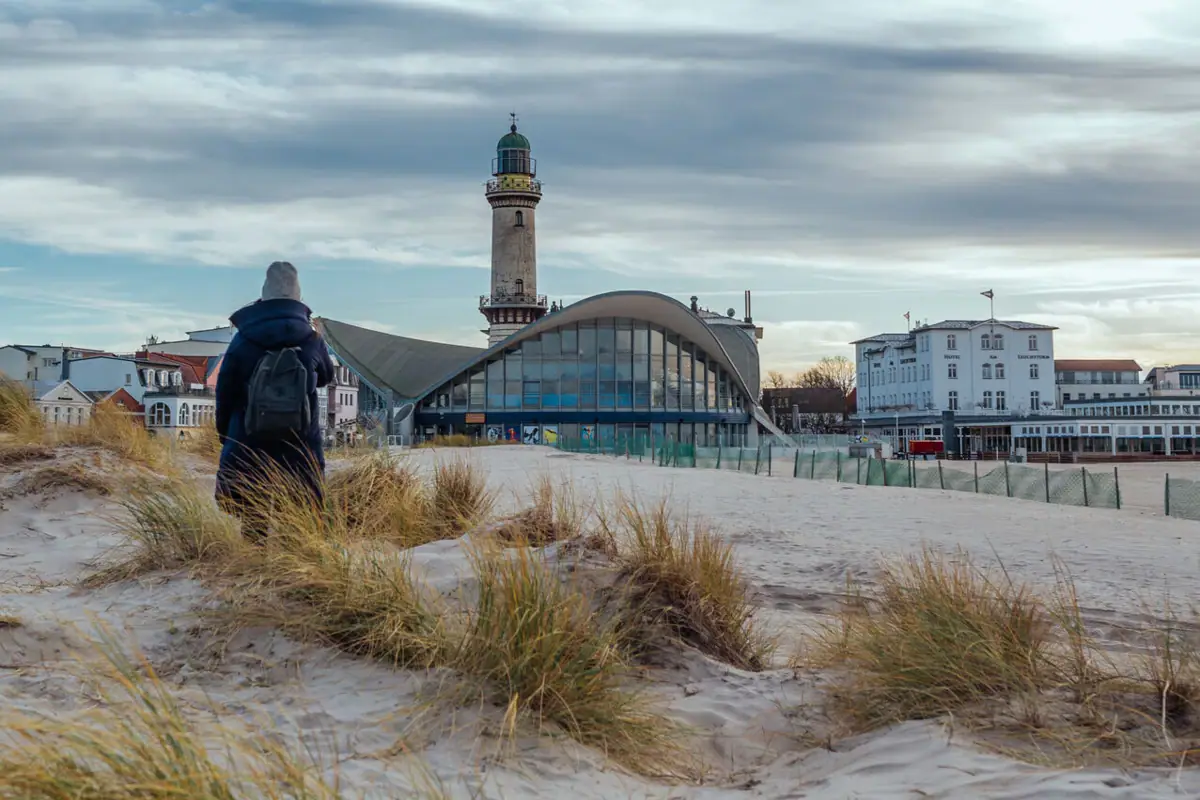 A person walking along the beach.