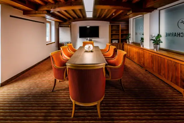 A room with a table and chairs.