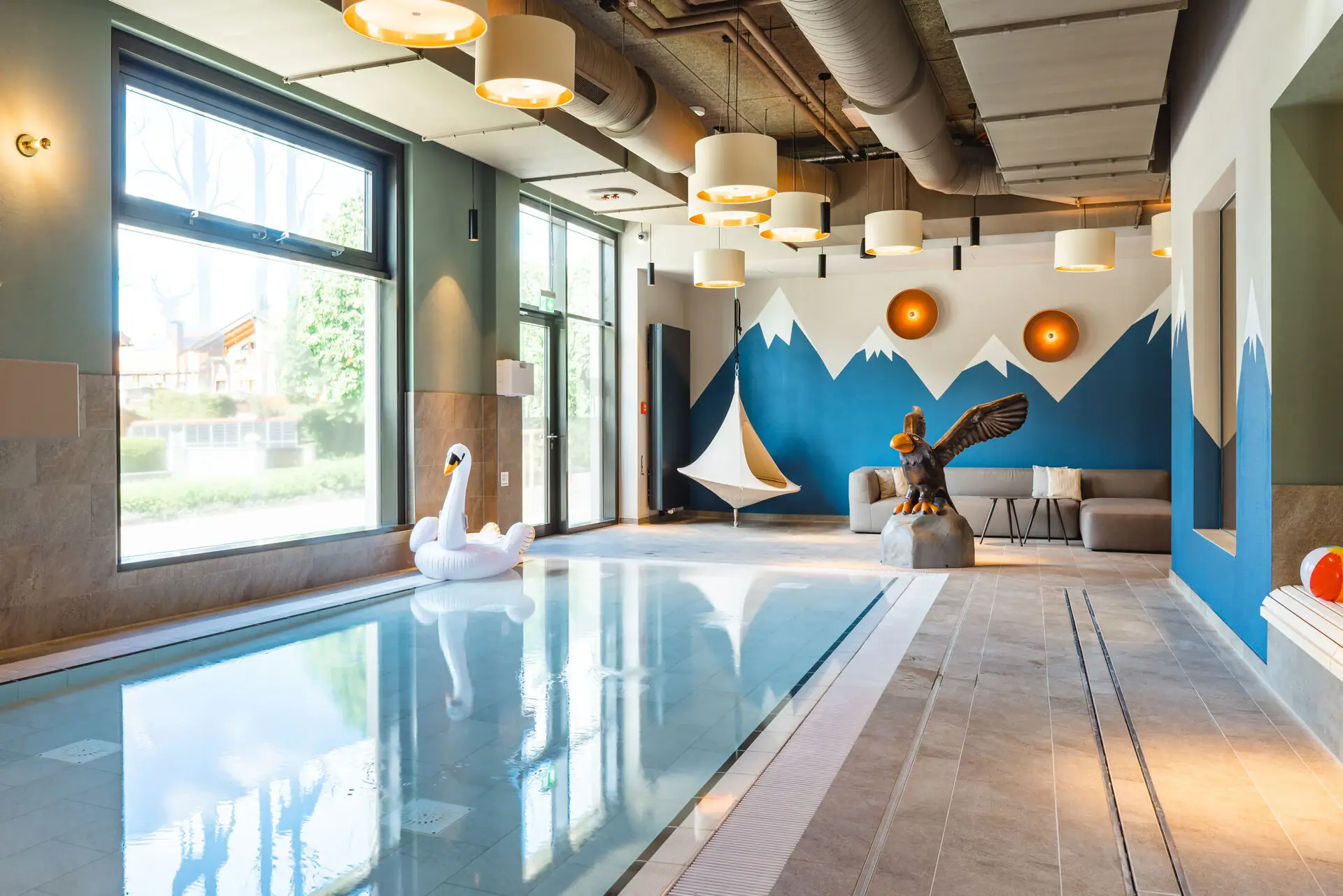 Children's pool A swimming pool with a swan and a bird sculpture.