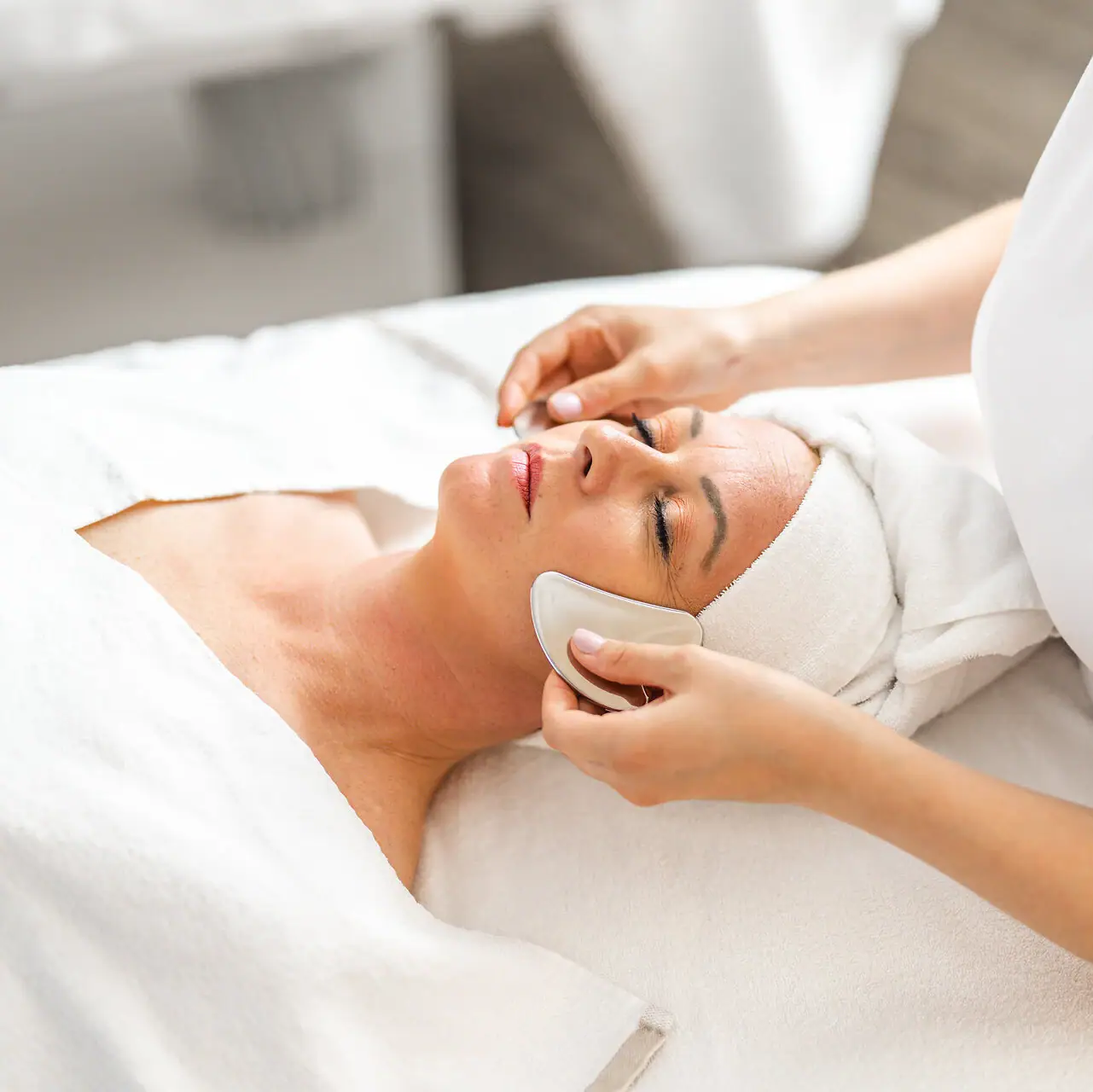 Application A woman receives a facial massage.