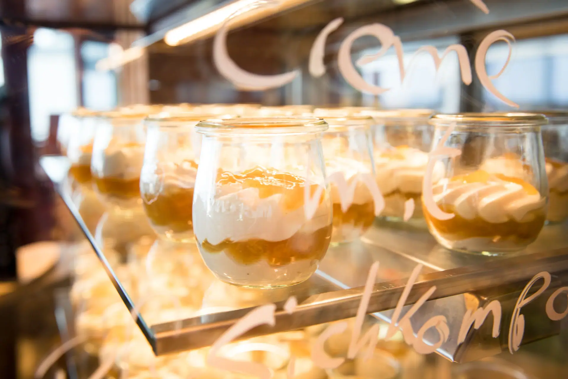 A group of dessert glasses.