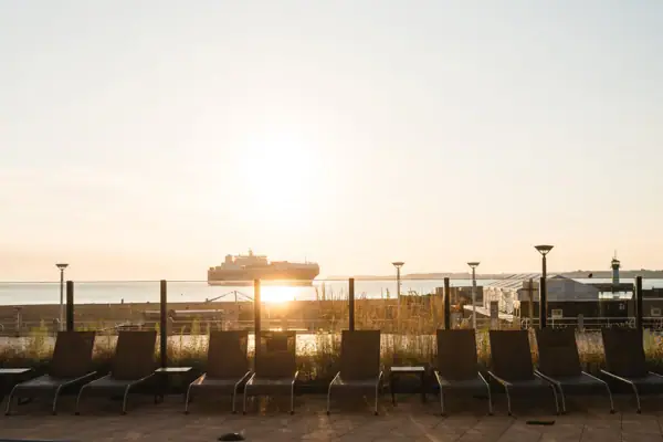 A row of chairs by the outdoor pool.