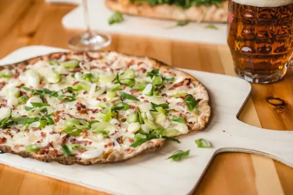 Tarte flambée on a cutting board