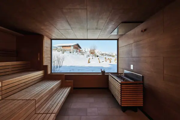 A sauna with a window and benches.