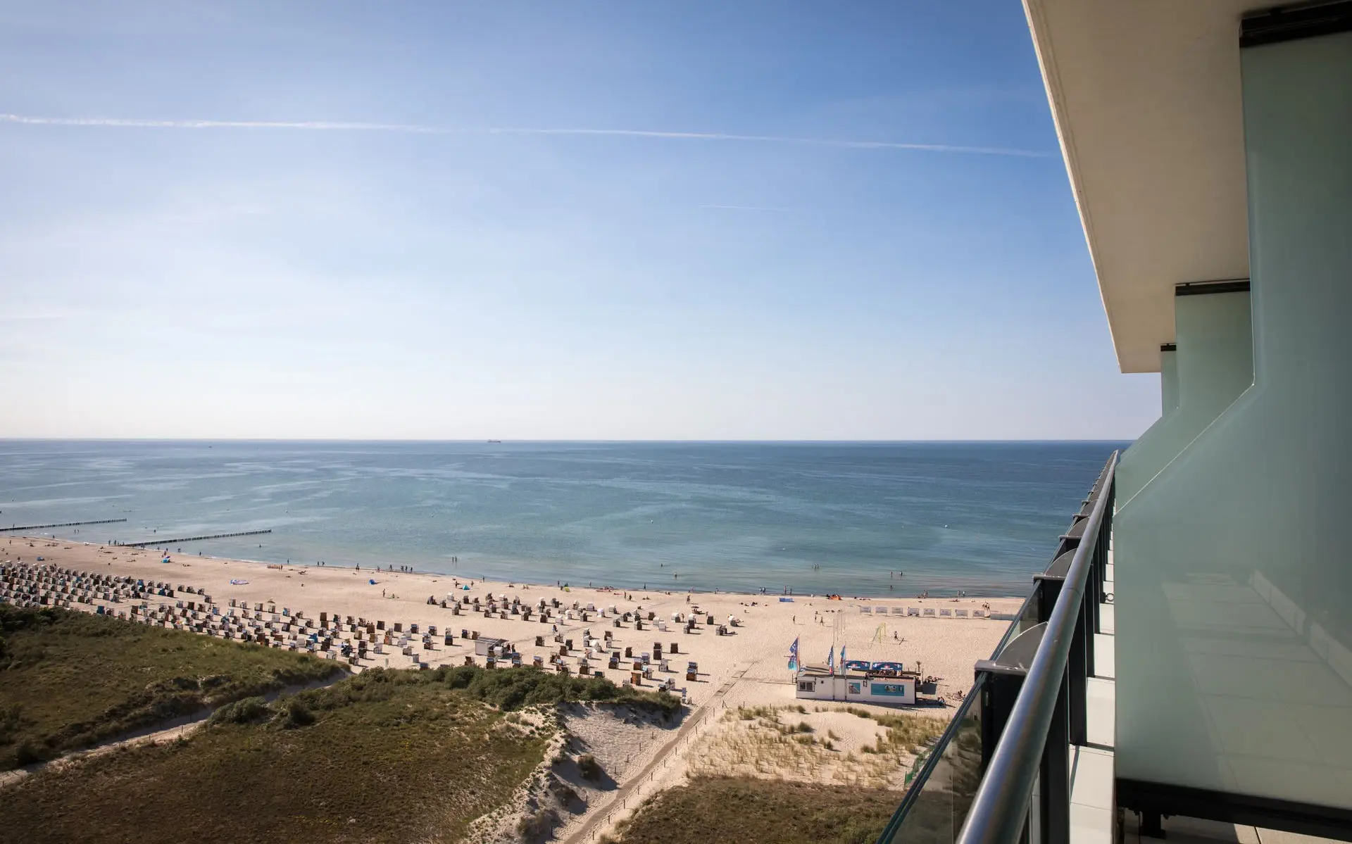 Aerial view of a stretch of beach with the sea on a sunny day.