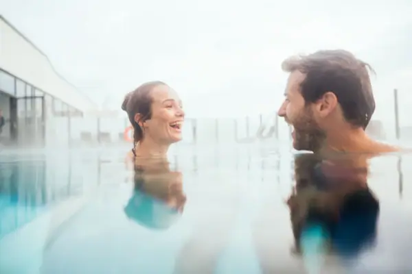A man and a woman in the swimming pool.