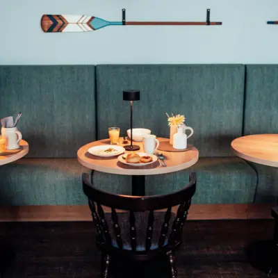 A table with plates and cups on it.