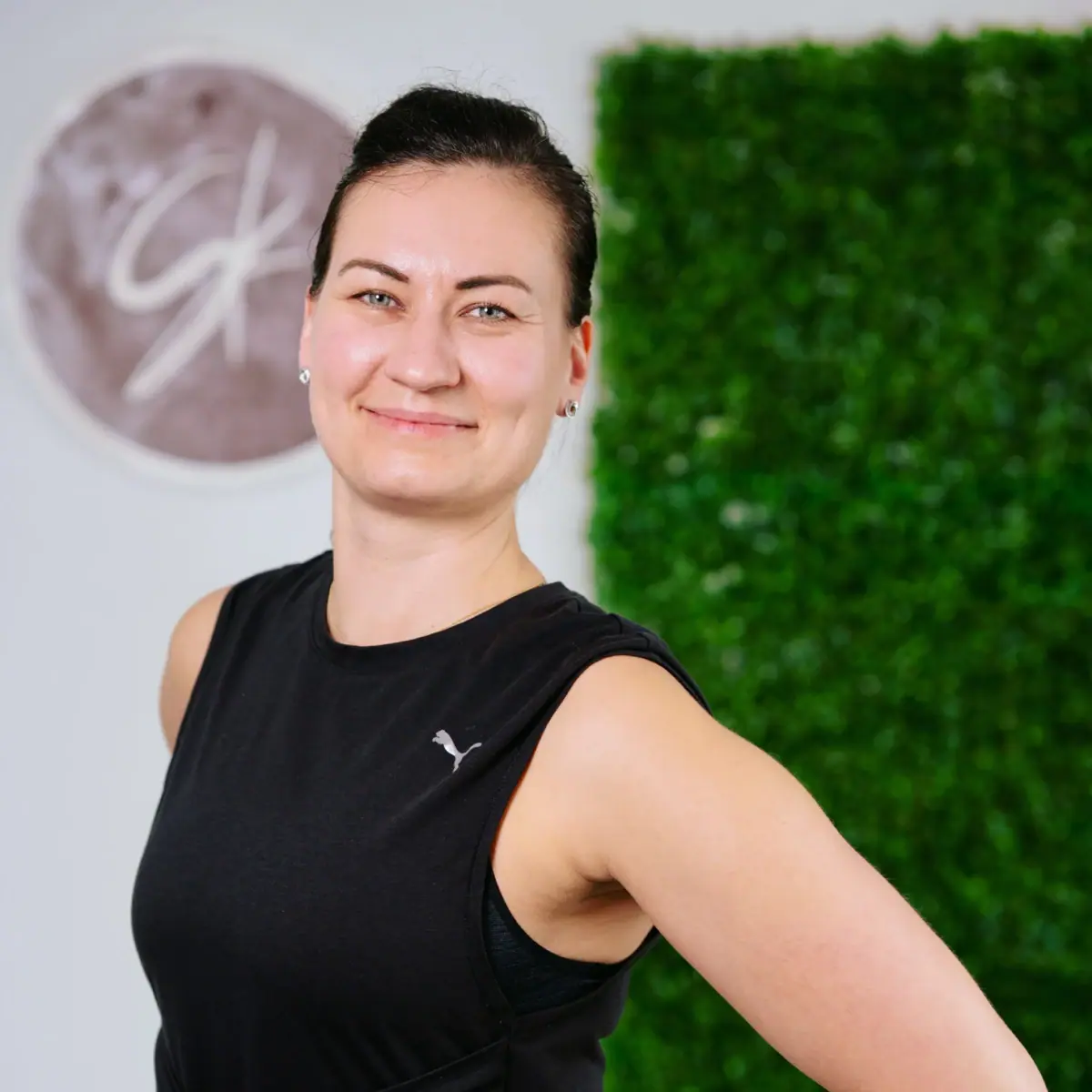 A woman in a black T-shirt.