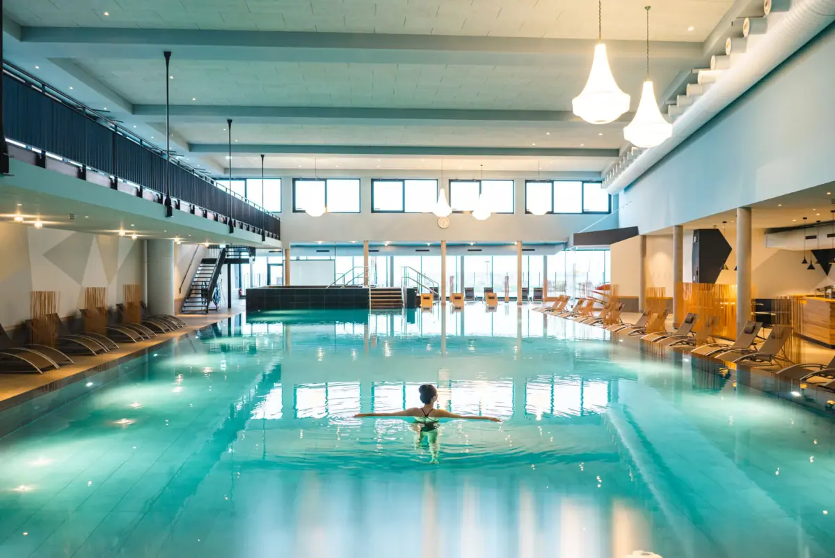 A woman in a swimming pool.