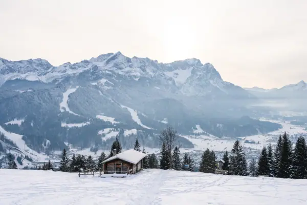 Winter in Garmisch-Partenkirchen with a chalet in the snow.