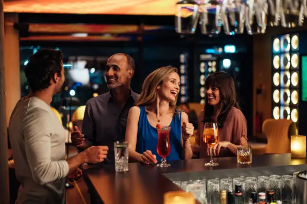 A group of people at a bar.